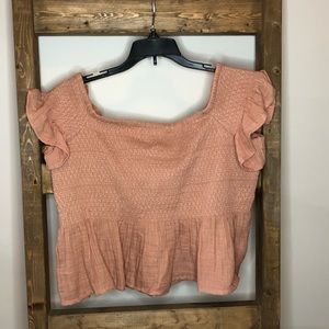 Salmon top with flowy shoulder and bottom